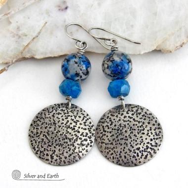 These handcrafted sterling silver earrings have a rustic, hand stamped texture and are accented with natural K2 granite and faceted blue apatite gemstones. This unique, interesting stone has beautiful blue azurite inclusions within a black and white speckled granite base. It was discovered in the foothills of world's second highest mountain, Mount K2, which it's name is derived from. The blue apatite was added to bring out the gorgeous blue inclusions in these stones. 