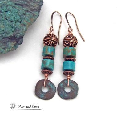 These handmade earrings feature natural turquoise stones accented with copper beads and organically shaped "rings" of copper with a soft turquoise patina finish. They have a modern chic bohemian style with a touch of exotic flair that makes a unique, bold statement. Handmade in the USA by Silver and Earth Jewelry.