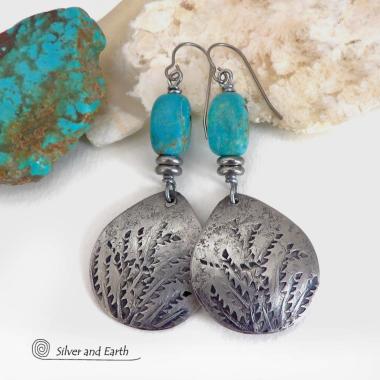 These handcrafted earrings feature silver pewter teardrop-shaped dangles with a hand stamped feather texture accented with natural turquoise stones and small stainless steel beads. They have a modern earthy style with lots of boho chic southwestern flair. They'll make a great gift for anyone that loves natural turquoise stones and southwest style jewelry. Handmade in the USA by Silver and Earth jewelry, a NM True Certfied Business. 