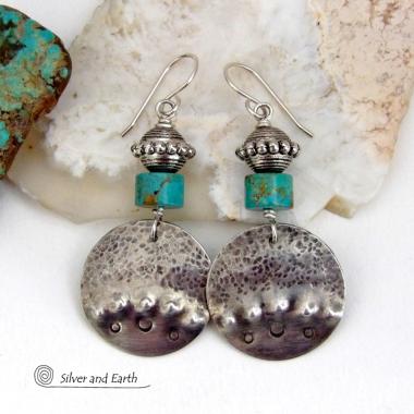 These handcrafted earrings feature uniquely textured hammered and hand stamped sterling silver accented with natural turquoise stones and silver plated beads. Bold and striking, they have a modern, southwest style with a touch of tribal flair. Handmade in the USA by Silver and Earth Jewelry. 